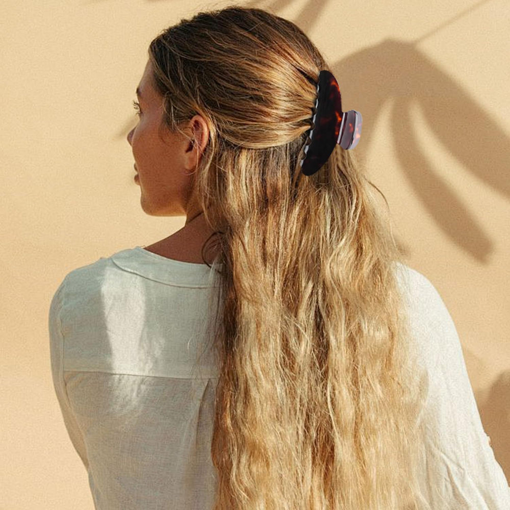 MAORULU holding a full updo to show strong hold for thick hair