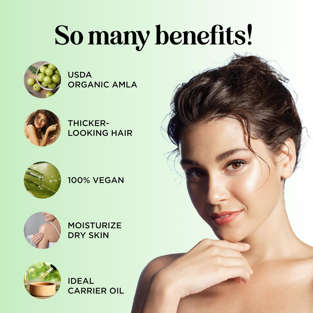 Maple Holistics amla oil drops on hair strand adding visible shine