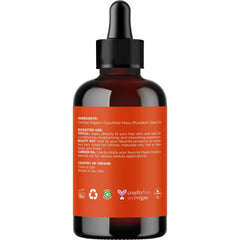 Applying Maple Holistics pumpkin seed oil as a hair mask for added moisture and volume