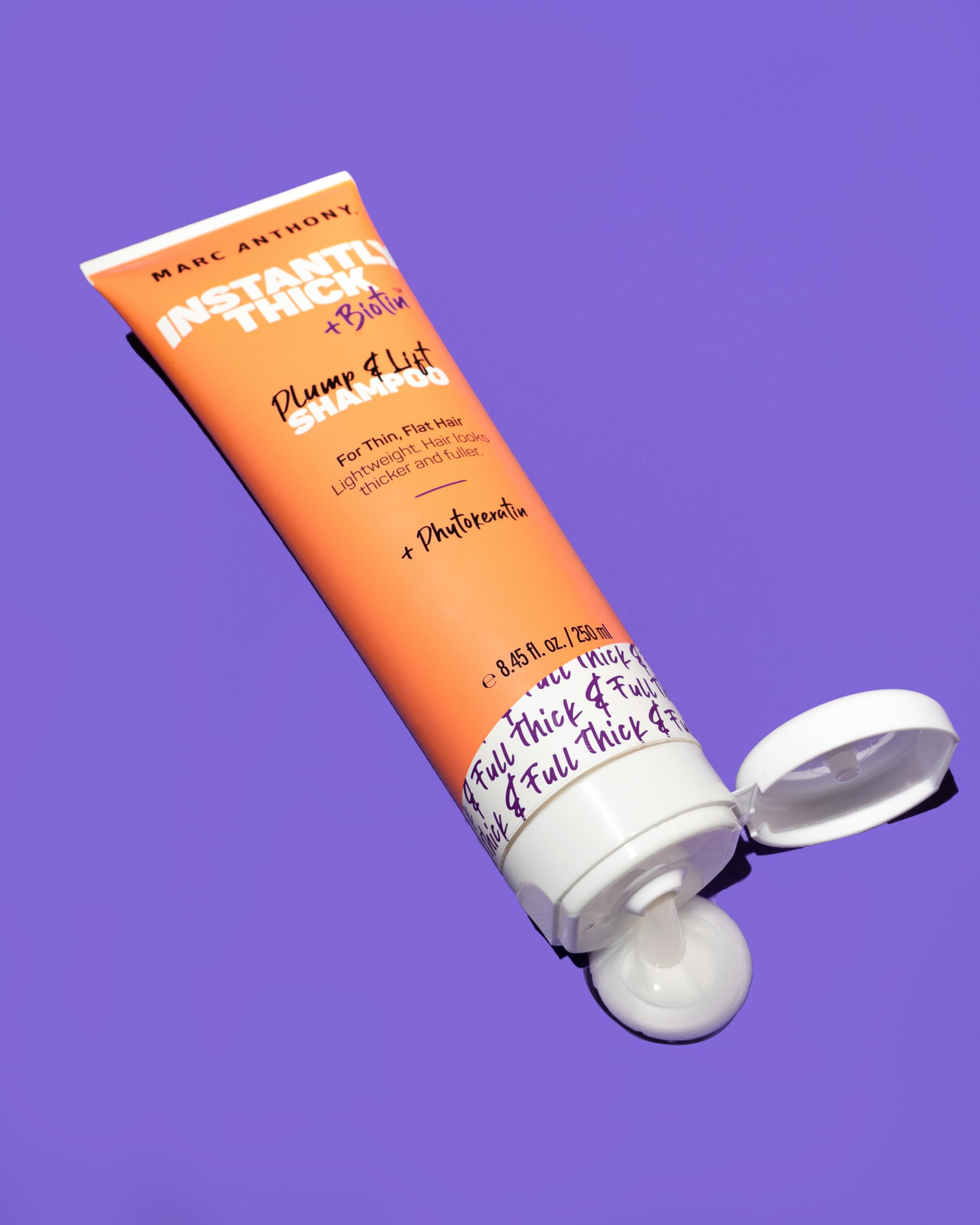 Marc Anthony shampoo being dispensed into hand demonstrating easy application and gentle lather