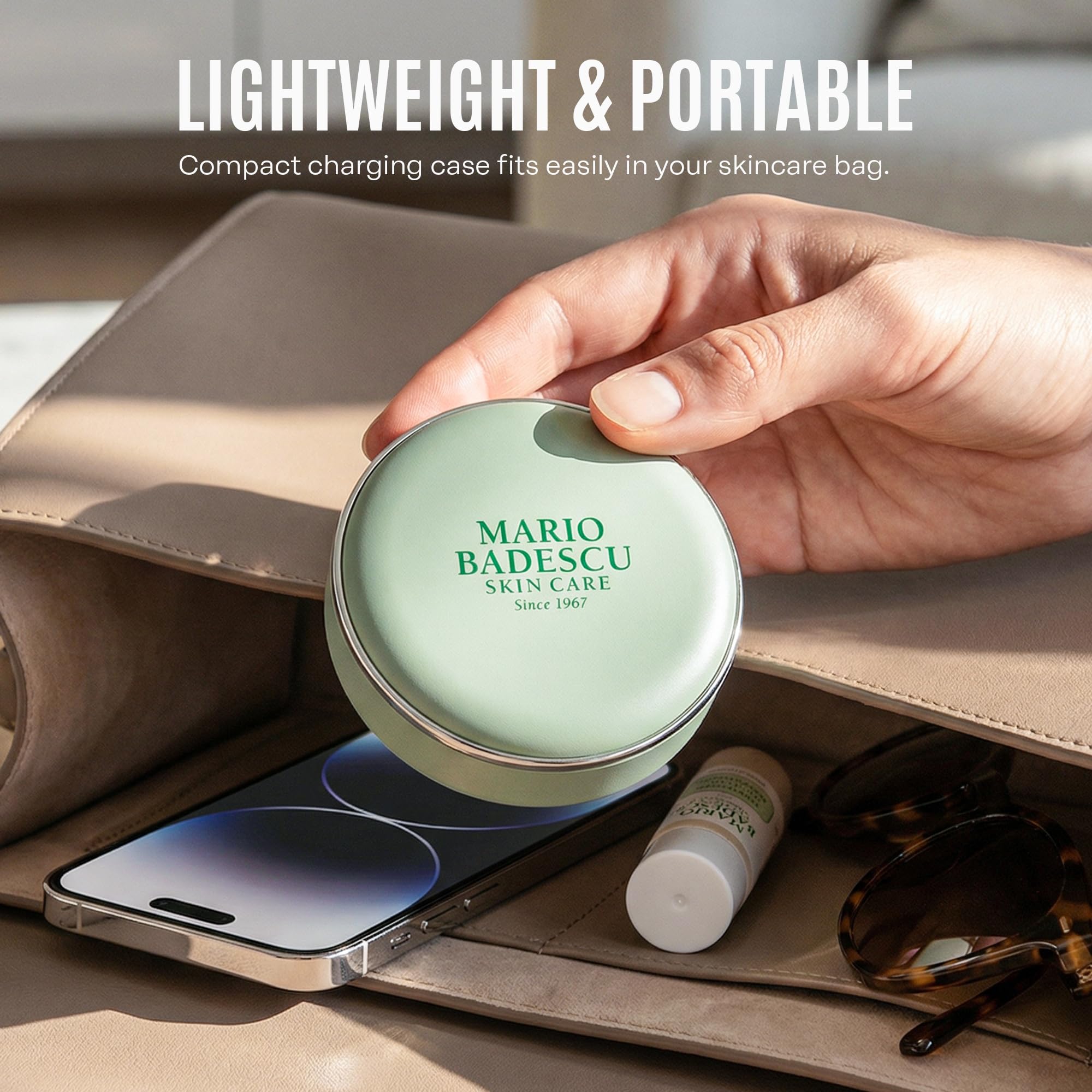 Mario Badescu device held in hand to show compact scale and portability