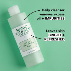 Papaya and grapefruit next to Mario Badescu product illustrating natural enzyme exfoliation