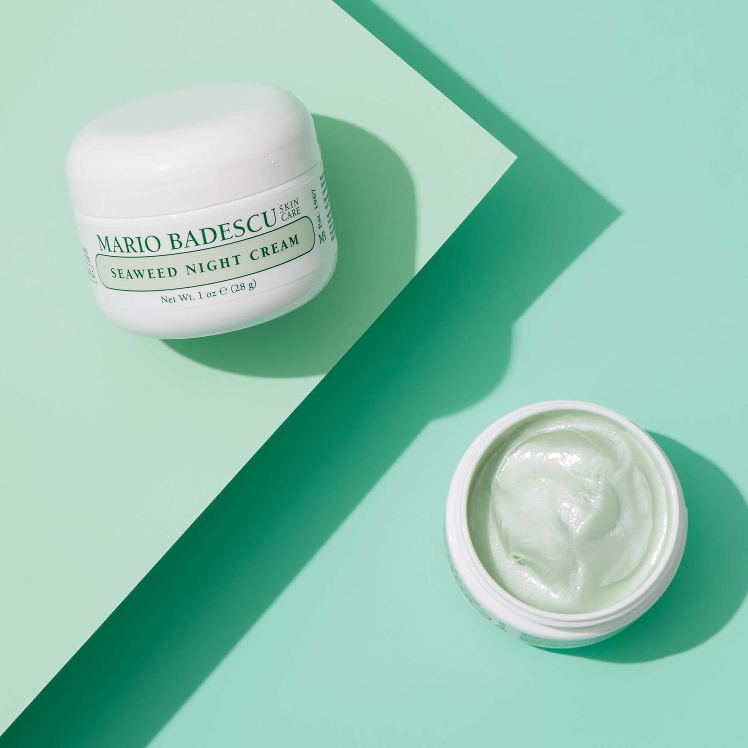 Mario Badescu 1 fl oz jar next to coin to show true size and portability