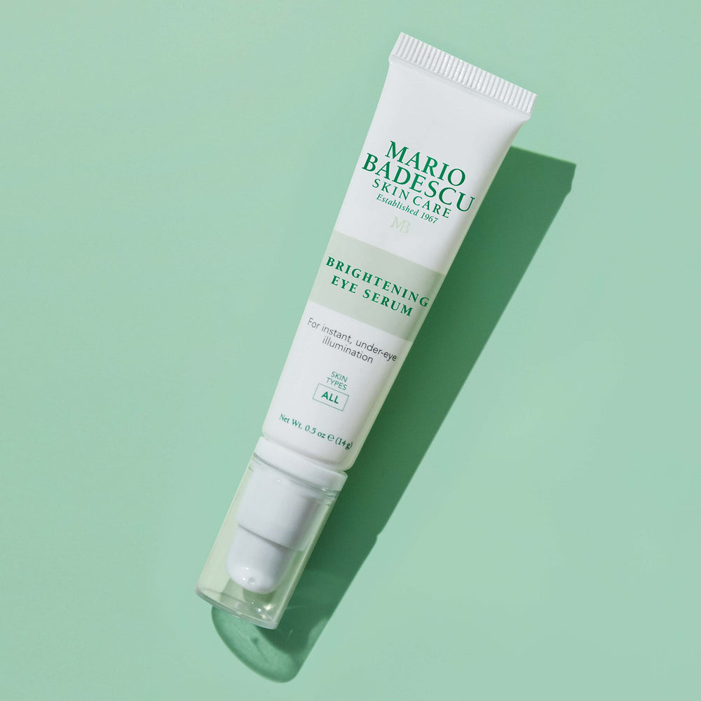 Mario Badescu serum beside makeup showing compatibility under concealer benefit