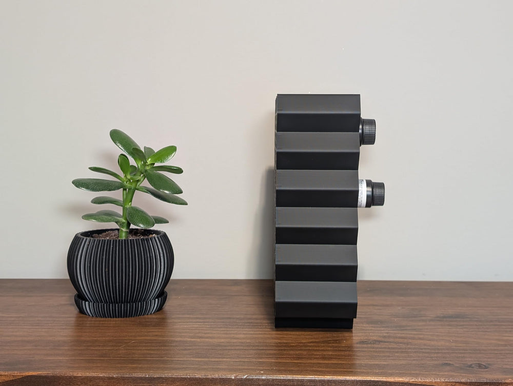 Markvicka Designs with bottles beside a ruler to show scale and storage capacity