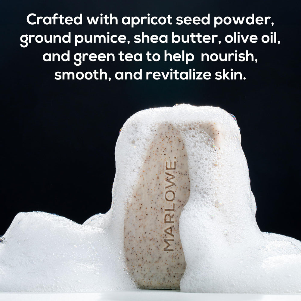 MARLOWE. close-up of scrub texture displaying apricot seed and pumice for buffing