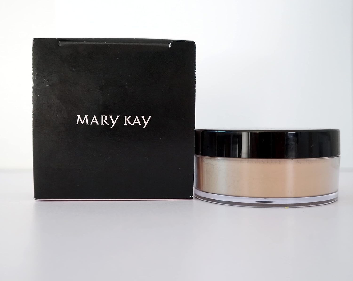 Mary Kay Silky Setting Powder front compact shows sleek packaging and travel convenience