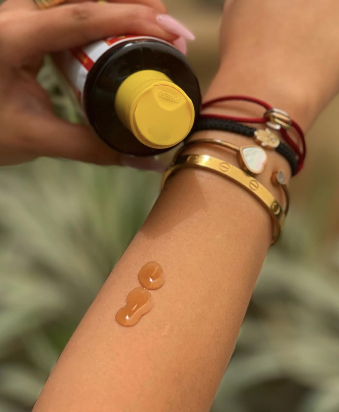 Application of Maui Island Secret on forearm demonstrating even coverage and fast tanning benefit
