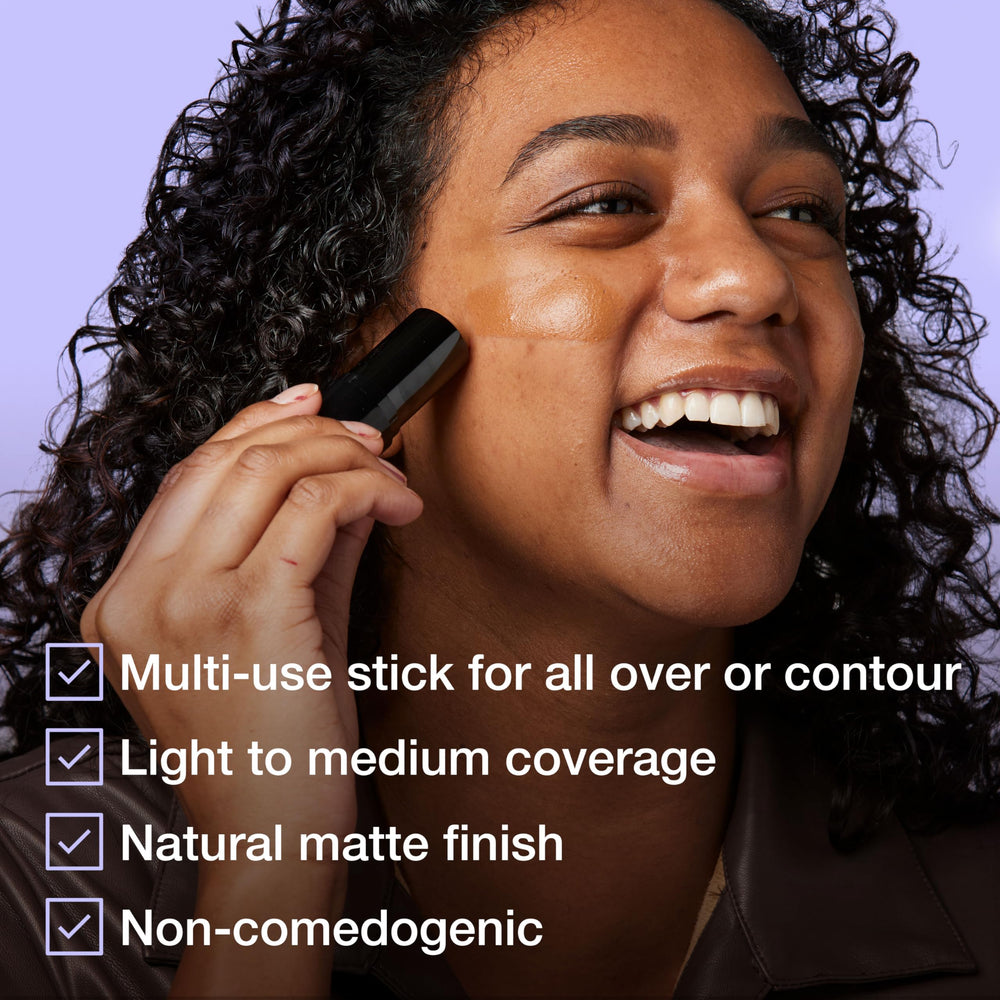 Maybelline Fit Me stick held in hand to show travel-friendly size and convenience