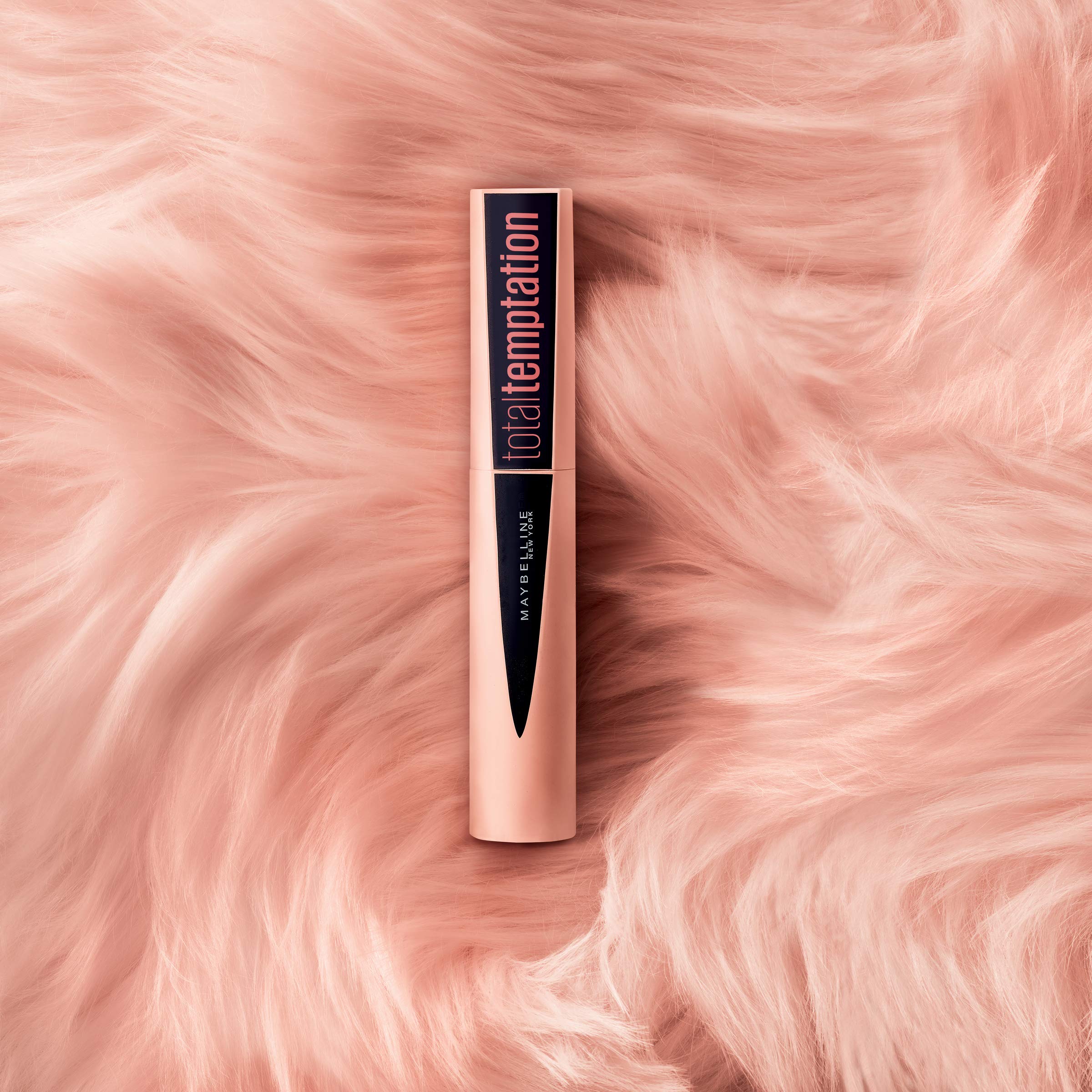 Maybelline Total Temptation next to ruler to display 0.27 fl oz compact size advantage