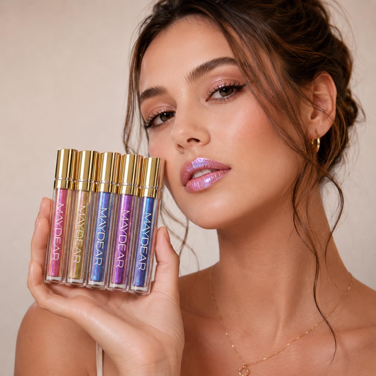 Maydear applied on model lips showing glossy diamond shimmer finish