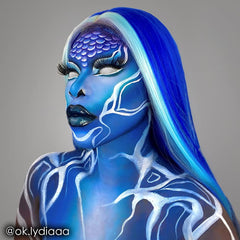 Mehron Makeup swatch applied on arm demonstrating strong blue coverage and layerability