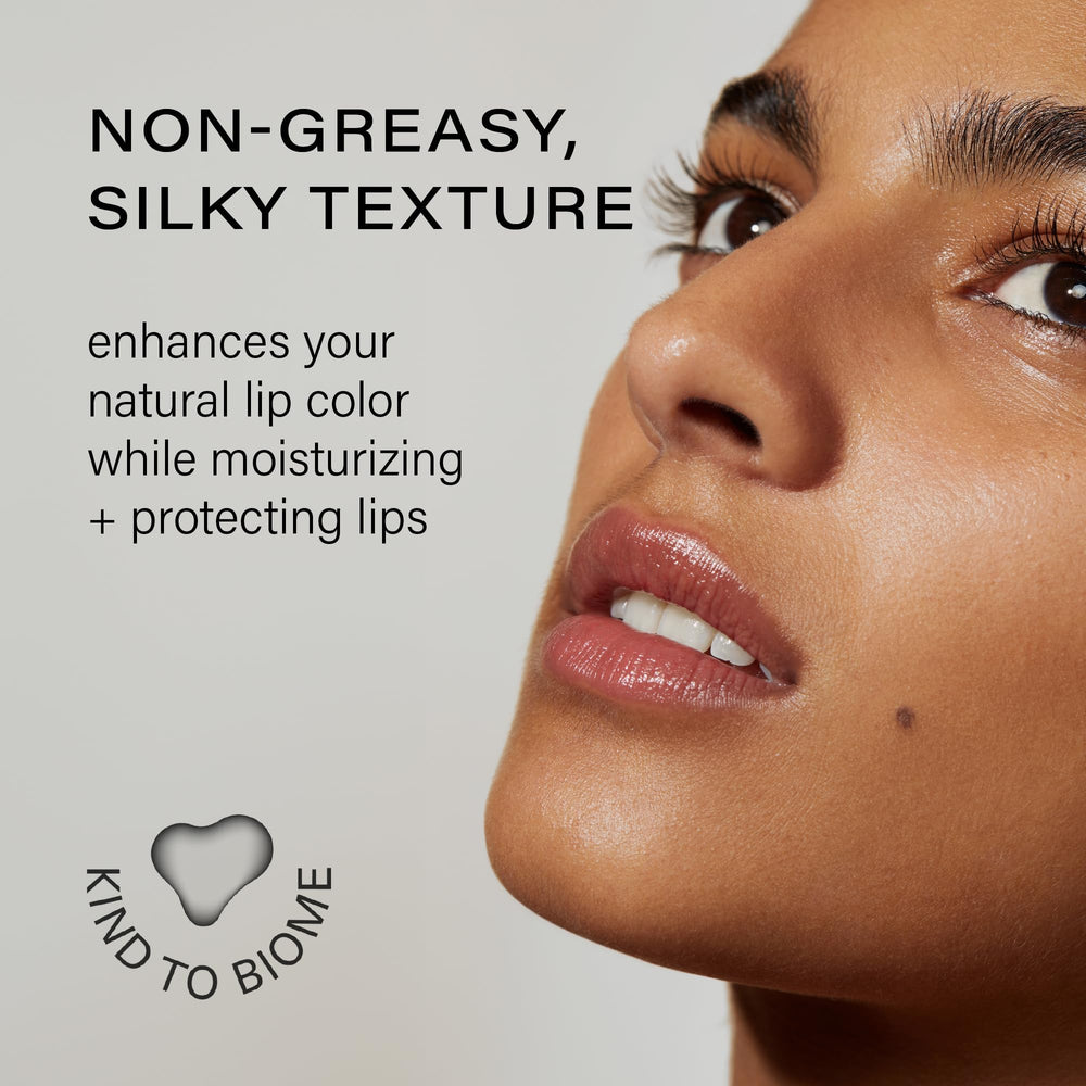 Melixir on model smiling to show natural glossy finish and everyday wear
