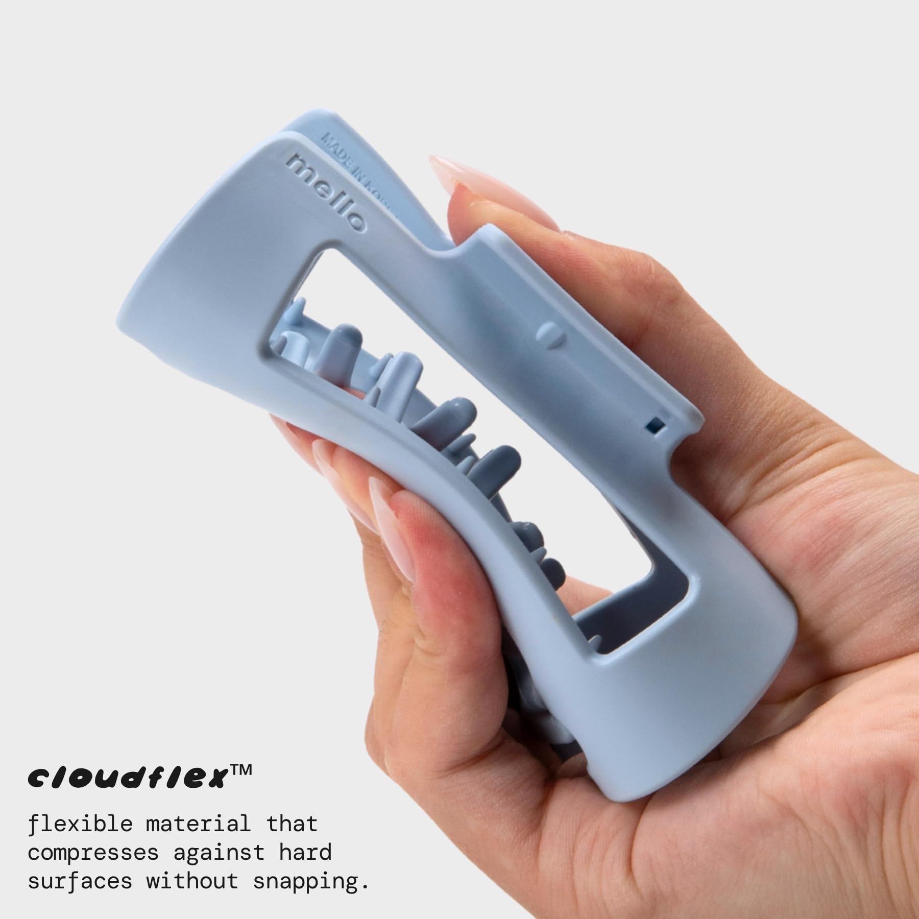 mello close-up of inward-curving teeth showing gentle pressure distribution for scalp comfort