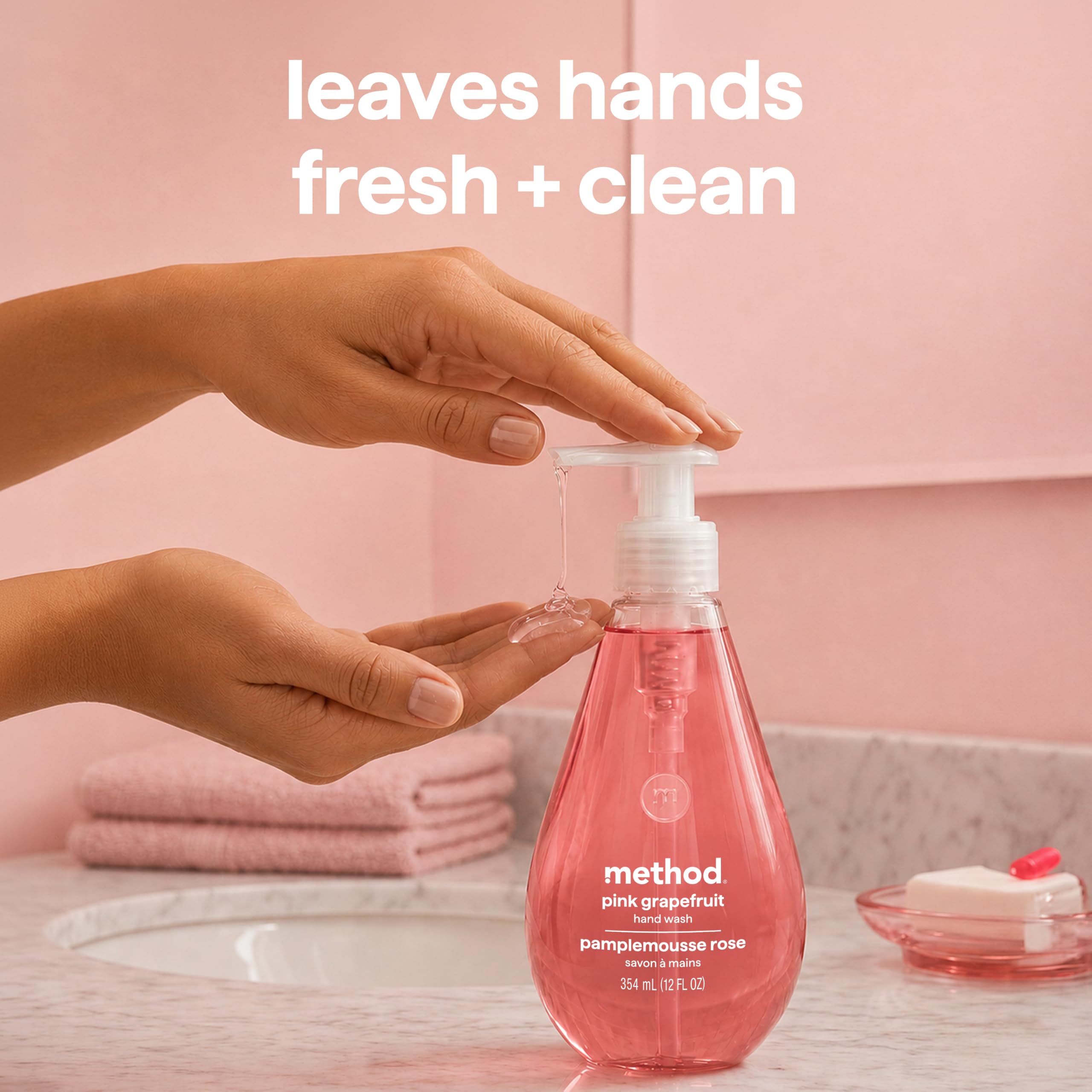 Method bottle beside a hand for scale showing 12 fl oz sizing and portability