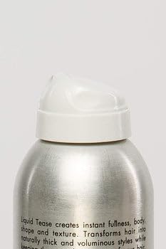 Michael Christopher applying spray at roots for noticeable volume benefit