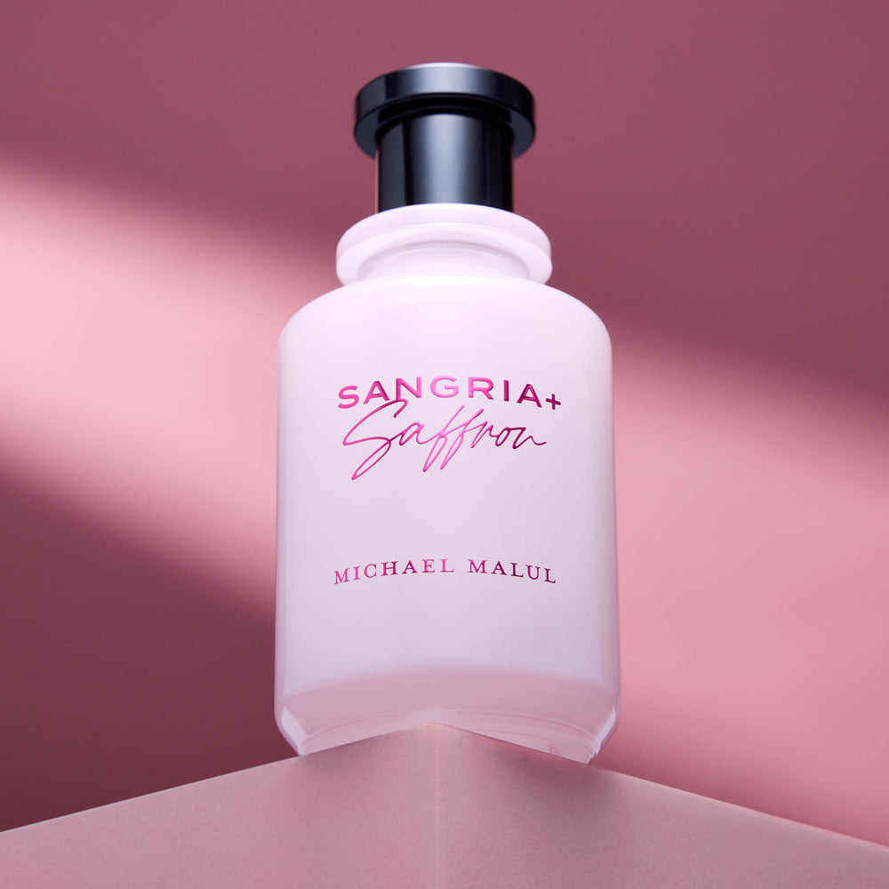 Michael Malul perfume on vanity in evening setting suggesting sophistication and allure