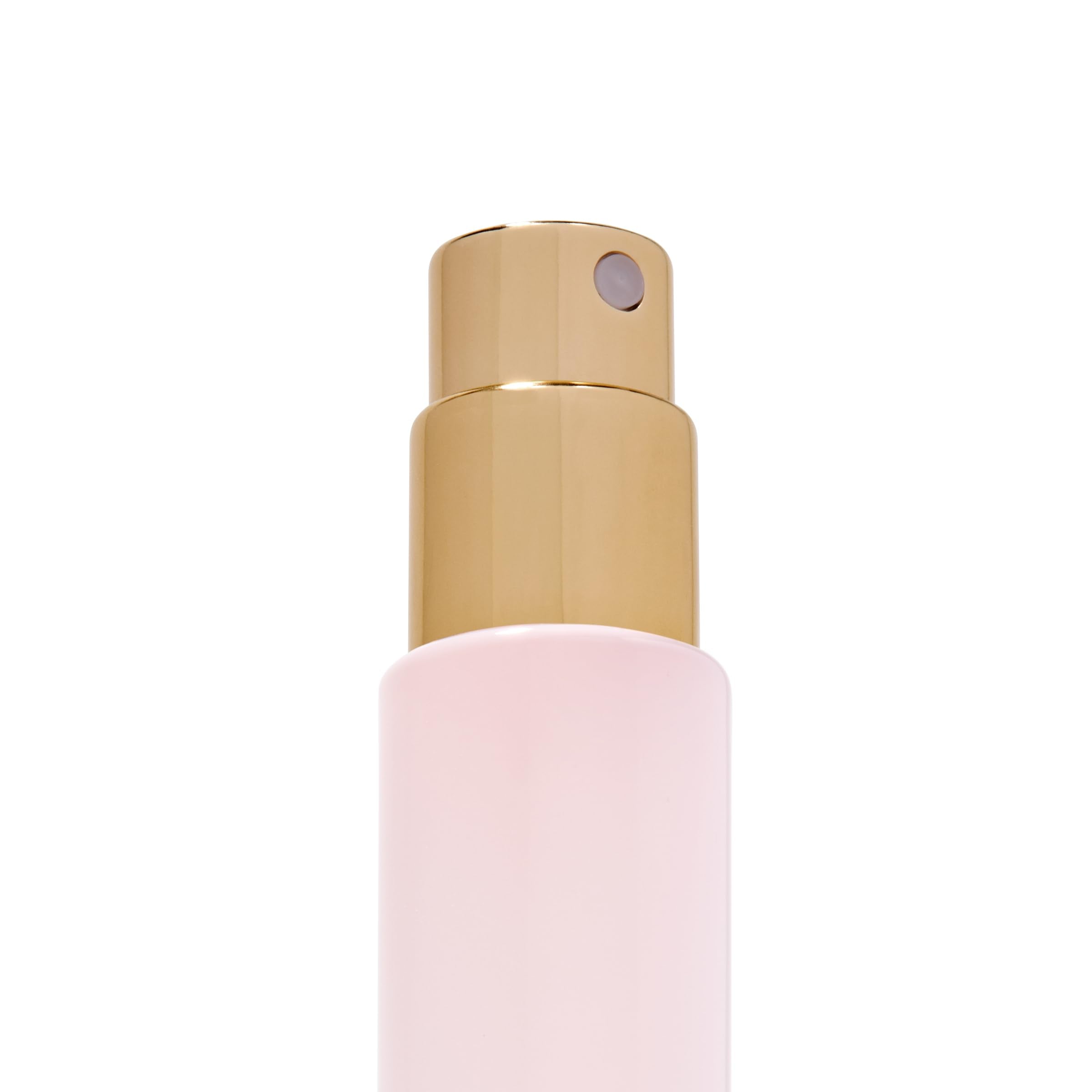 Michael Malul being sprayed from a travel vial demonstrating controlled application benefit