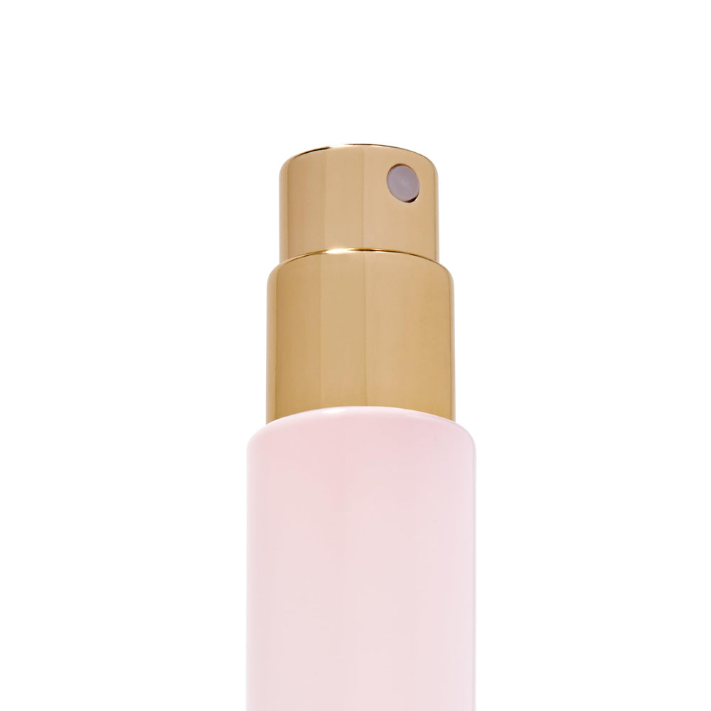 Michael Malul being sprayed from a travel vial demonstrating controlled application benefit
