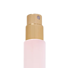 Michael Malul being sprayed from a travel vial demonstrating controlled application benefit