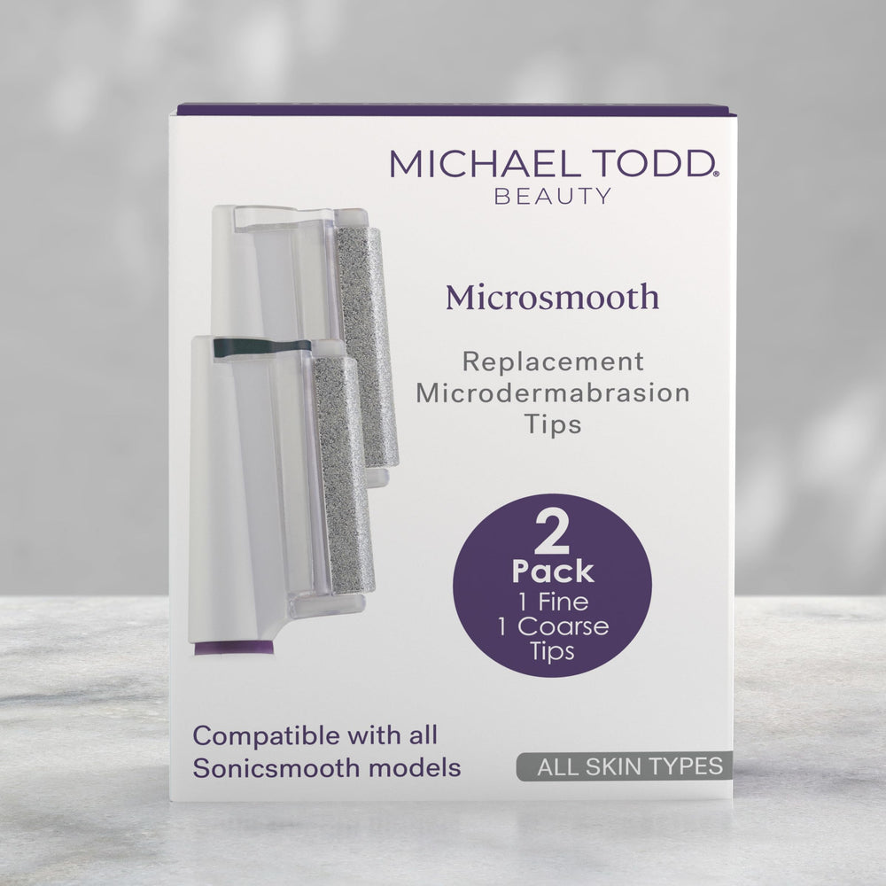 MICHAEL TODD tip next to coin showing compact size and travel convenience