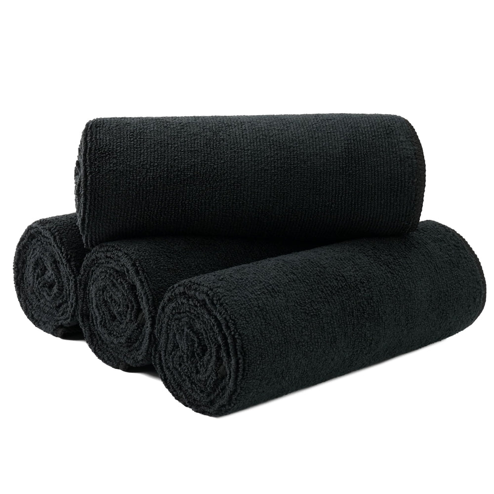 MICROFI front packaging view showing four black towels and quick-dry benefit