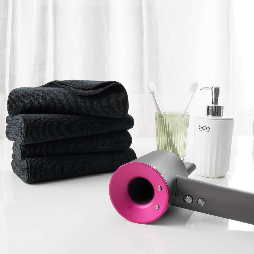 MICROFI towel next to ruler showing 16x29 inch size for full coverage