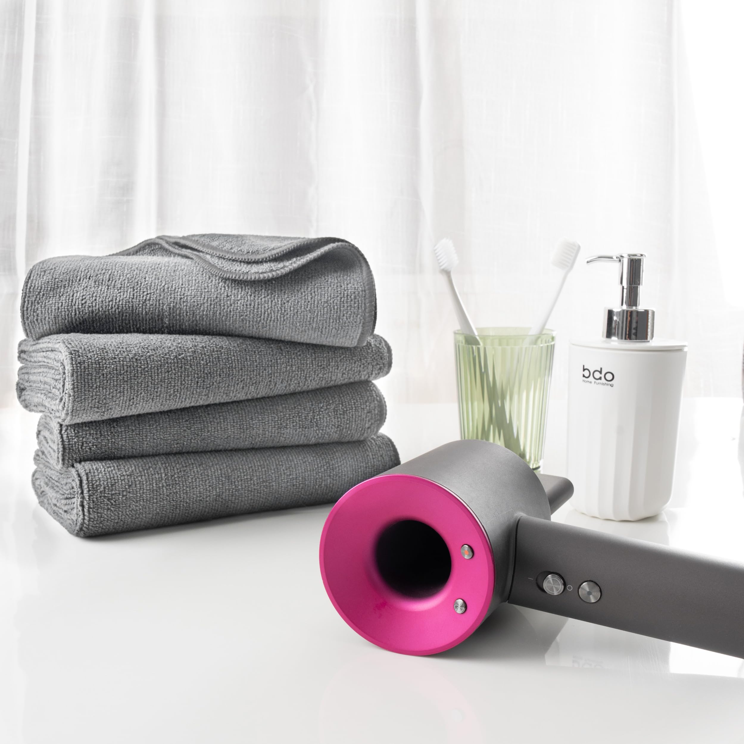 MICROFI towel held by hand showing 16 x 29 inch size for full hair coverage