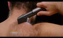 Microtouch array of four comb attachments and skin guard for consistent length control