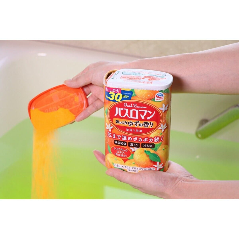Migdla jar beside a hand to show 600g size and convenient portioning benefit