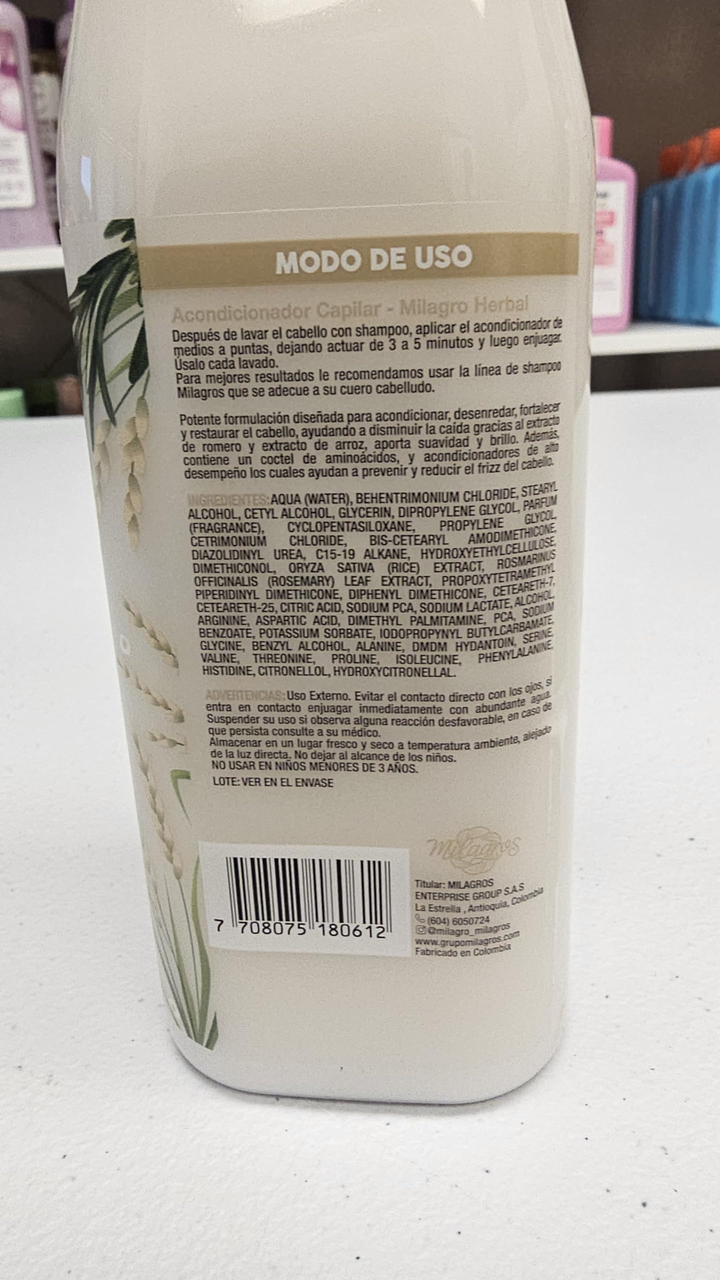 Milagros 450 ml bottle next to common object for size comparison and convenience