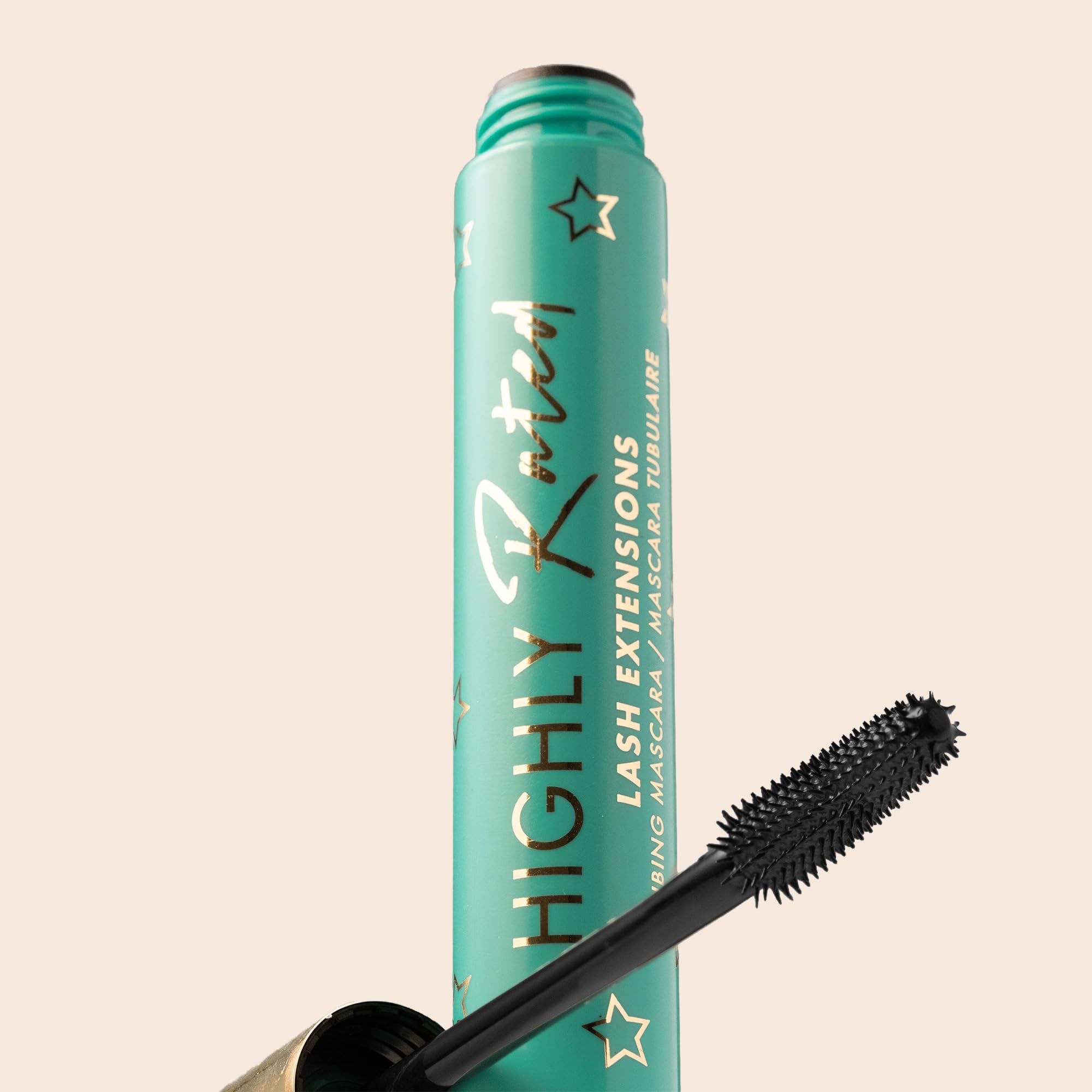 Milani lifestyle shot applying mascara in front of mirror for everyday ready lashes