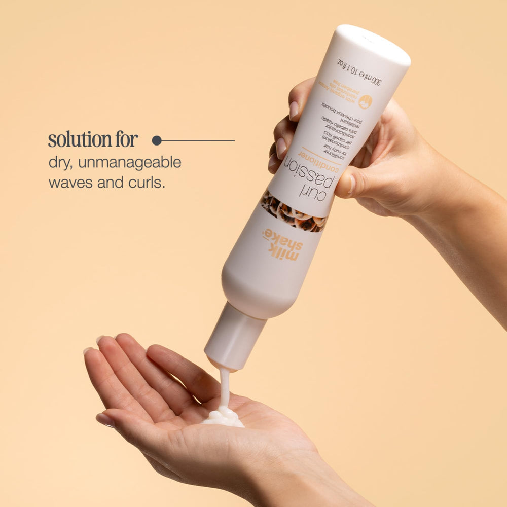 milk_shake conditioner in hand showing 10.1 oz scale and portability