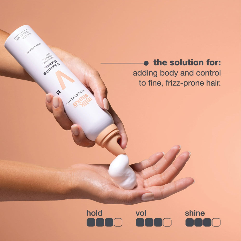 milk_shake mousse foam texture in hand illustrating lightweight, airy hold