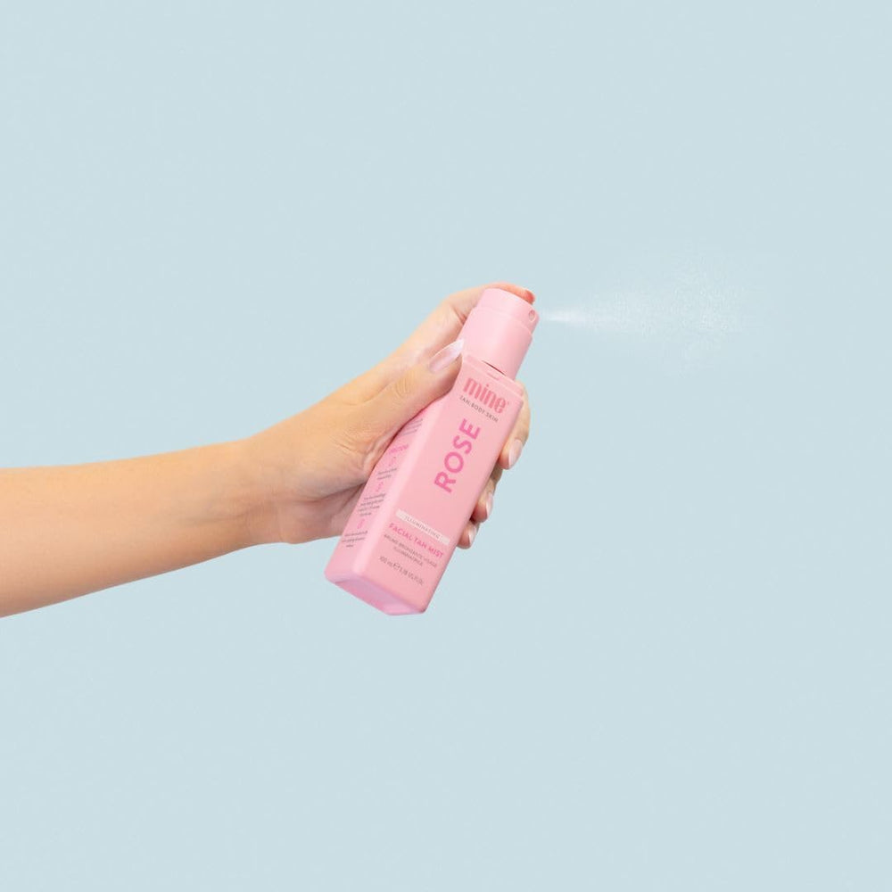 MINETAN BODY.SKIN bottle held for scale demonstrating compact travel-friendly benefit
