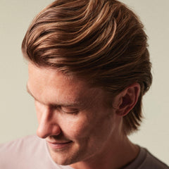 MITCH applied to damp hair demonstrating root lift before blow-dry