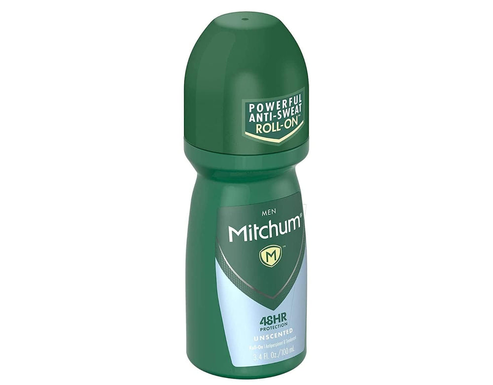 Mitchum roll-on next to hand to show compact 3.4 oz travel-friendly size