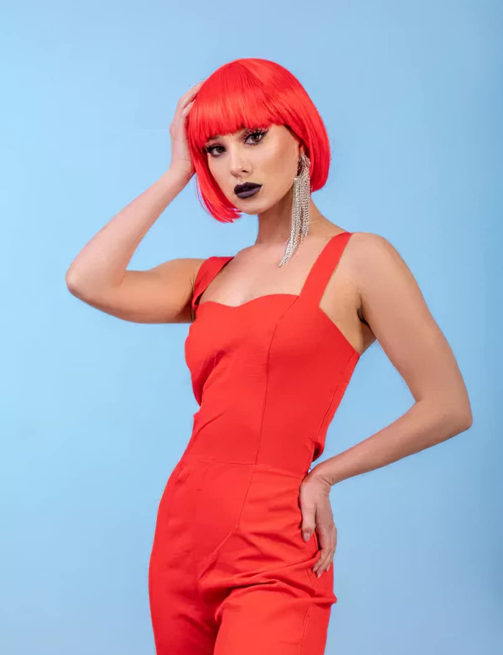 MIUSKATL wig held in hand showing 12-inch scale for size reference