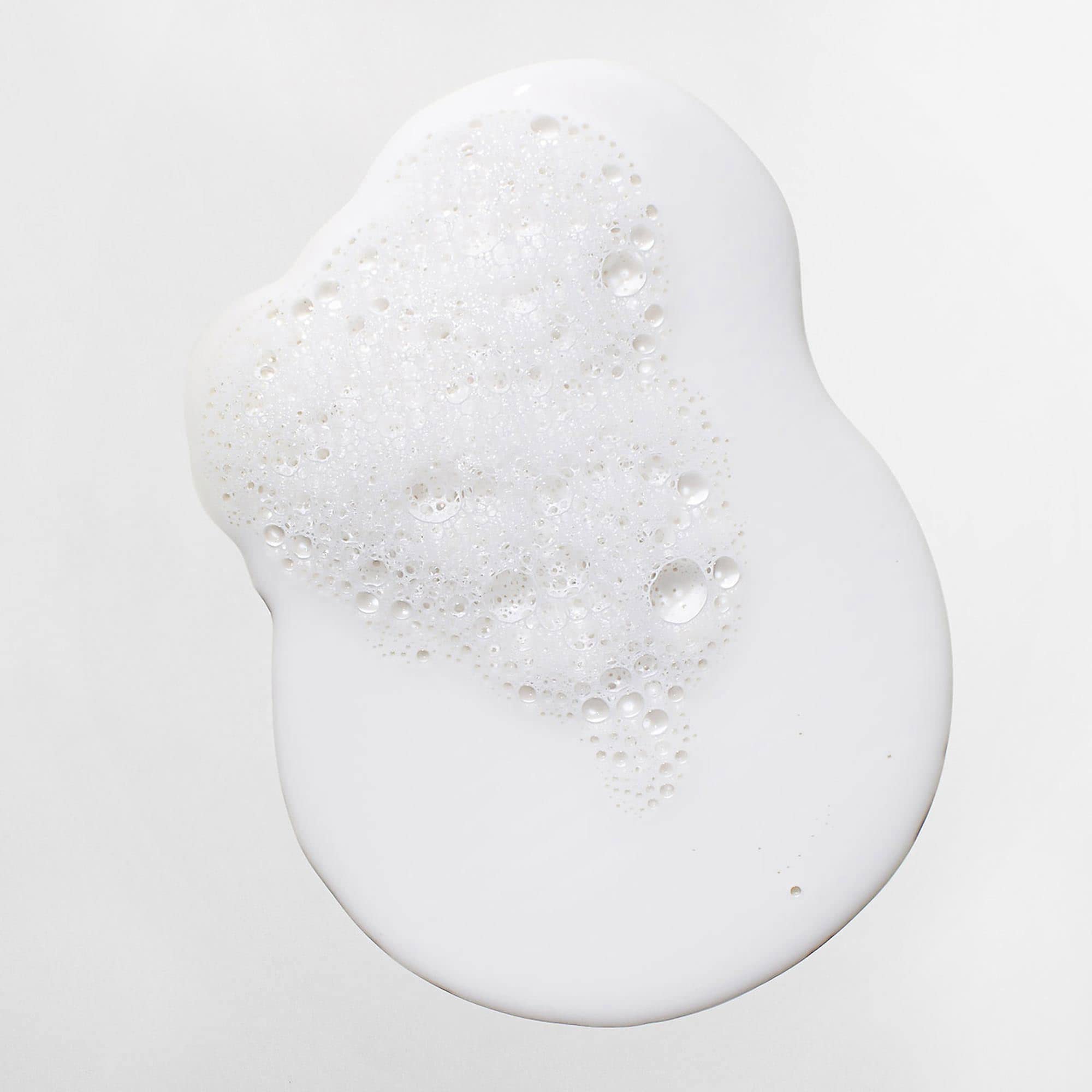 Mizani before and after scalp comparison showing reduced flakes
