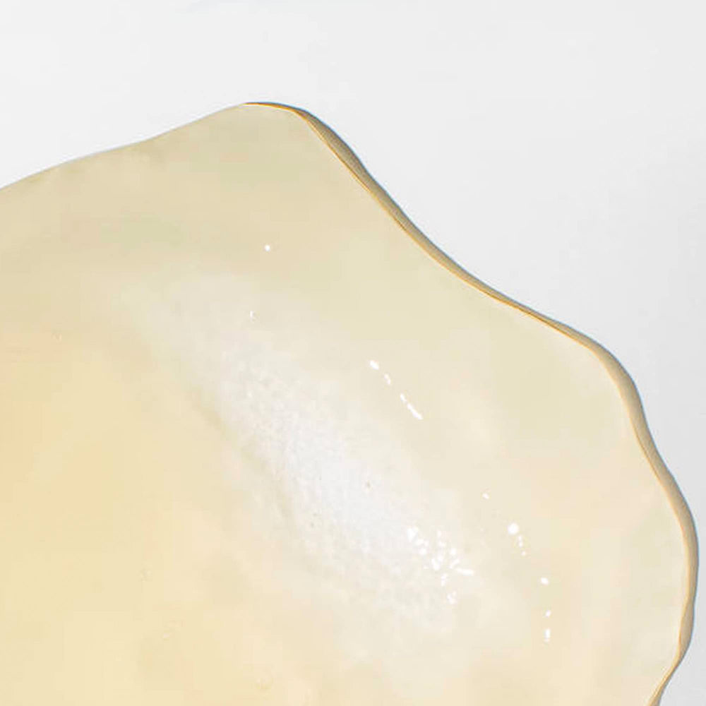 Mizani edge-control close-up demonstrating neat edges and shine benefit