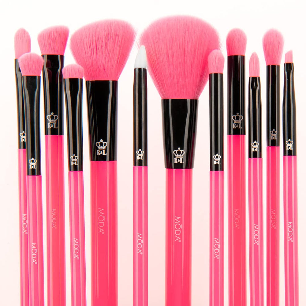 MODA brushes held in hand for scale, demonstrates comfortable grip benefit
