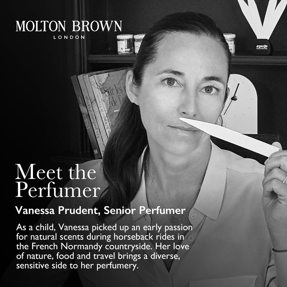Molton Brown hand wash being topped up in glass bottle, refill reduces single-use plastic