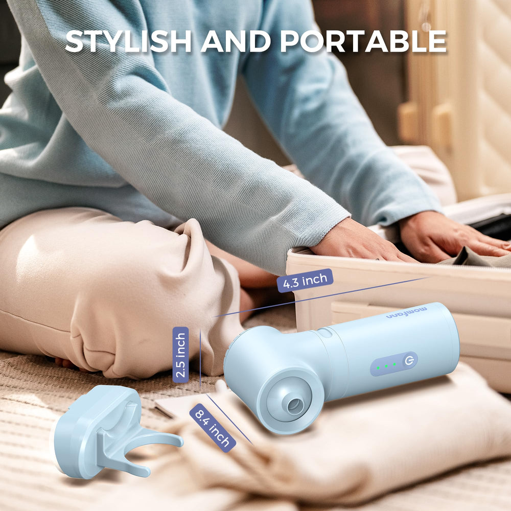 MOMFANN next to a hand for scale showing compact, lightweight portability