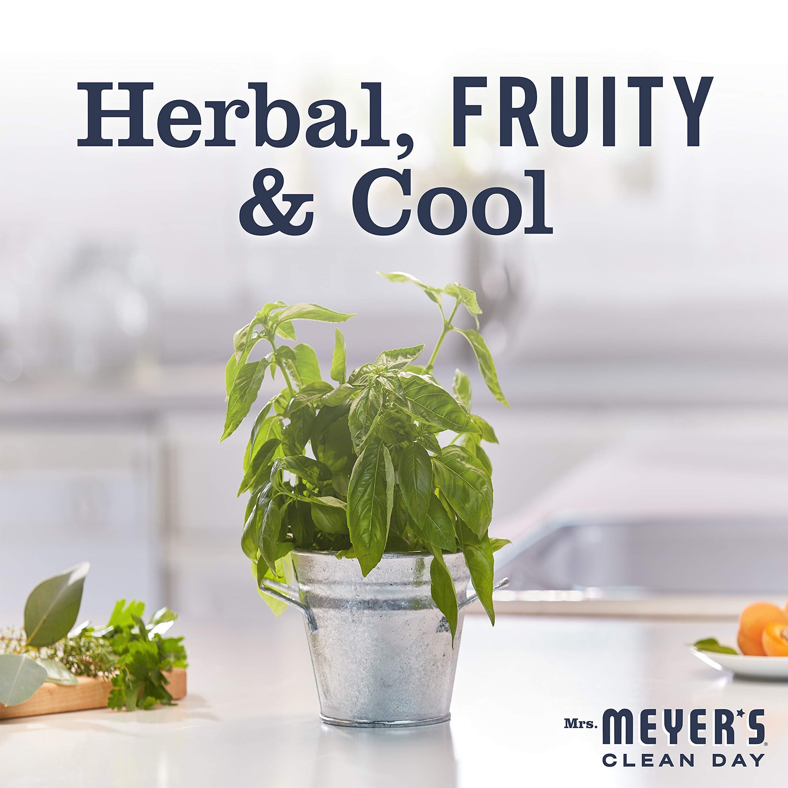 Mrs. MEYER'S ingredient flatlay with olive oil and aloe vera emphasizing natural ingredients