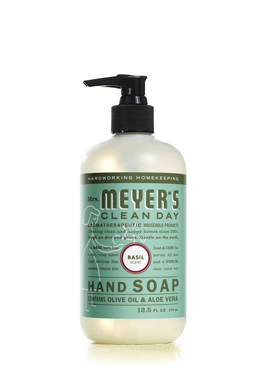 Mrs. MEYER'S bottle held in hand showing 12.5 oz size and portability