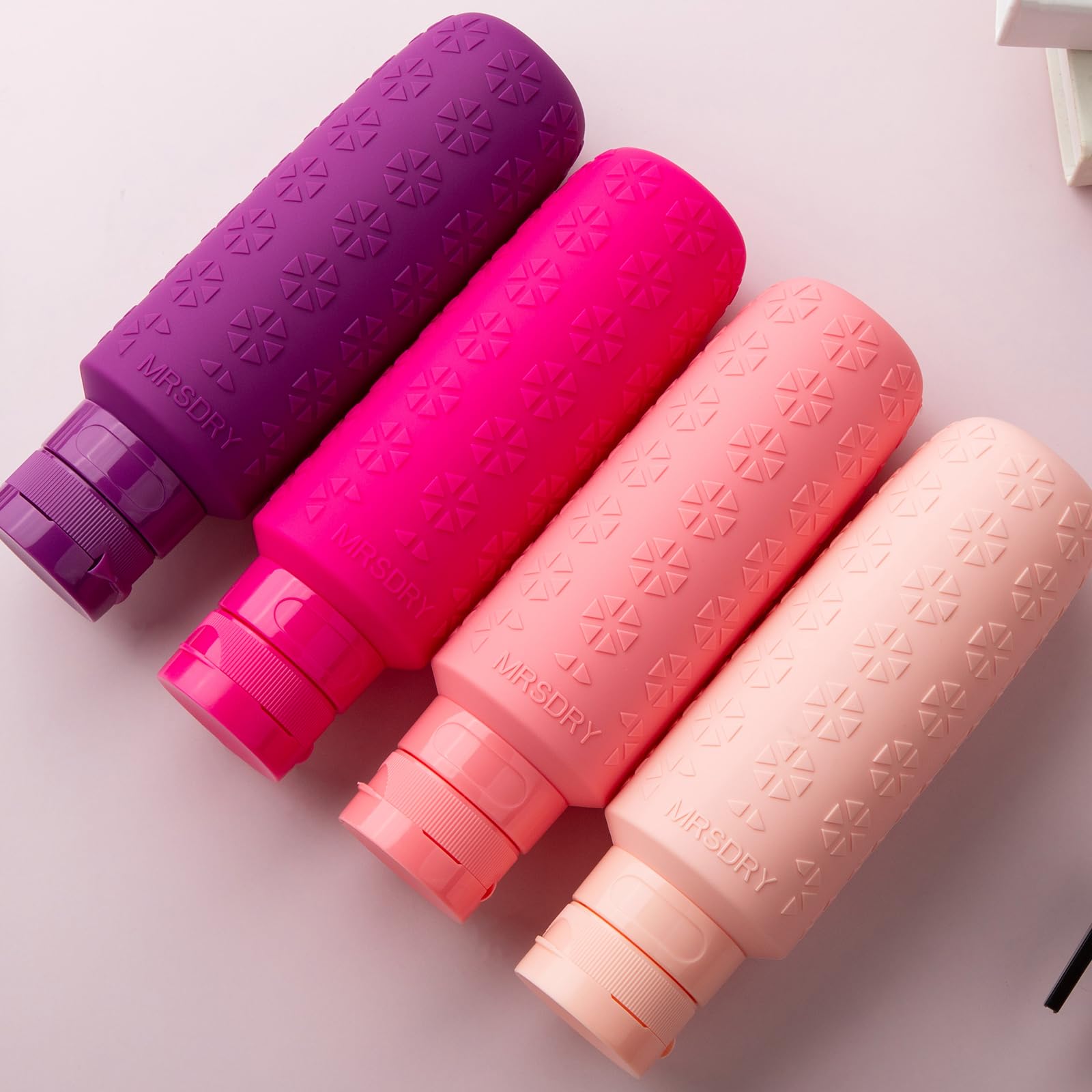 Mrsdry four bottles flatlay showing cohesive set and storage ease
