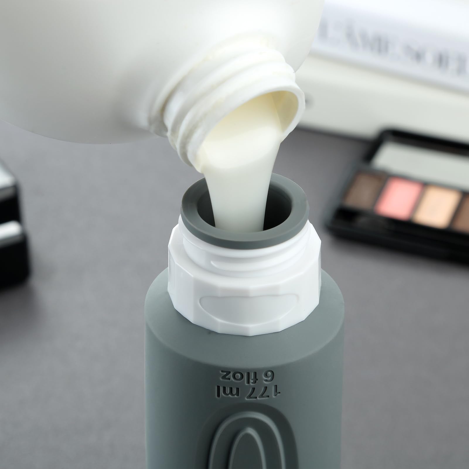 Mrsdry bottle held in hand to show 6oz scale and convenient refillable capacity