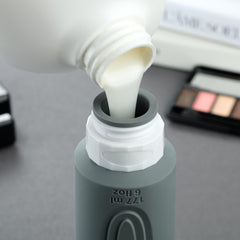 Mrsdry bottle held in hand to show 6oz scale and convenient refillable capacity