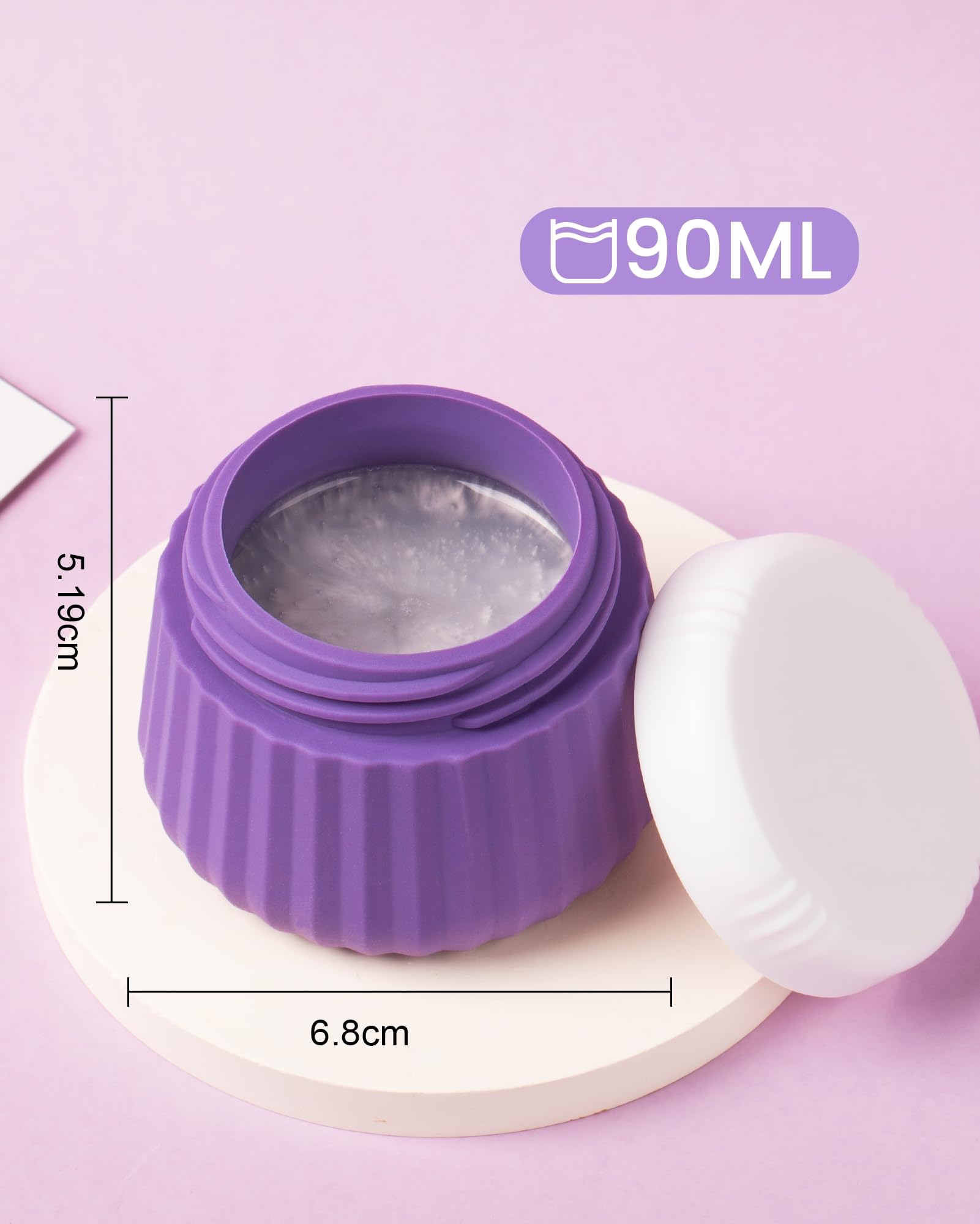 Mrsdry jar held in hand to show scale and convenient carry-on sizing