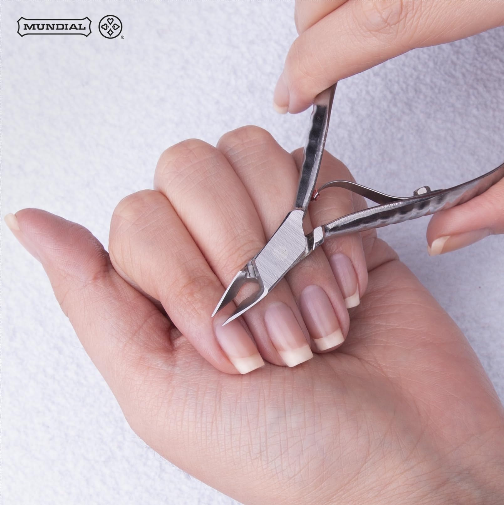 Mundial pliers inside manicure kit showing correct size and professional readiness
